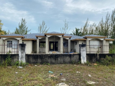 BB-195  FIXER-UPPER-4 BEDROOM/3 BATHROOMS; LAUNDRY ROOM, TWO-CAR GARAGE WALLED AND GATED OVER THE BRIDGE