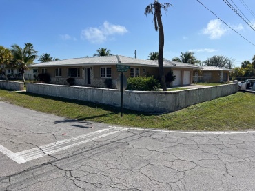 LOT NUMBER 18, LUCAYAN BEACH SUBDIVISION, LOCATED AT THE CORNER OF SEA GRAPE LANE AND ROYAL PALM WAY IN LUCAYA.